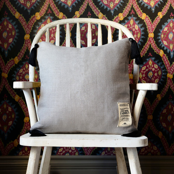 Frost Grey Linen Cushion by Mind the Gap Designer Pillow NOMAD STORY 100% Linen Made in United Kingdom Black tasseled corners 20 x 20 in - Swanky Fabrics -
