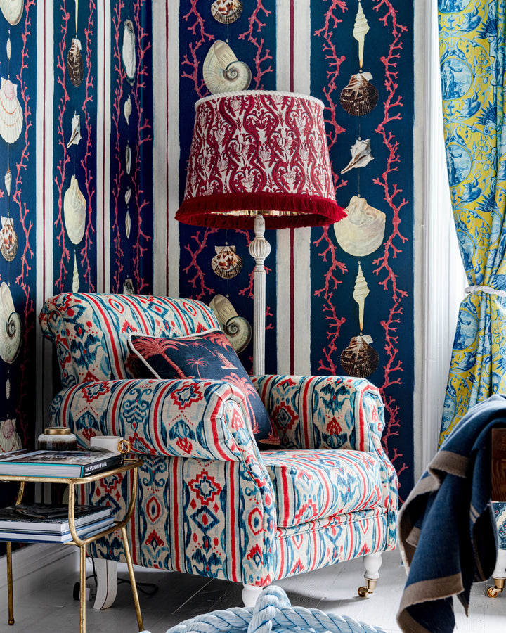 COQUILLAGE Samba Red Wallpaper (WP20573) by Mind The Gap | WP20573 | SUNDANCE VILLA | 3 rolls x 52x300 cm / 20.5x118.1 in | 0.52m / 20.5in | 3m / 118in | 4.65sqm / 50sq ft | 100cm / 39.3in | Blue, White, Red | Non-woven Textured | Paste the wall | 3-rolls in a box | Fabric Carolina | https://www.fabriccarolina.com/